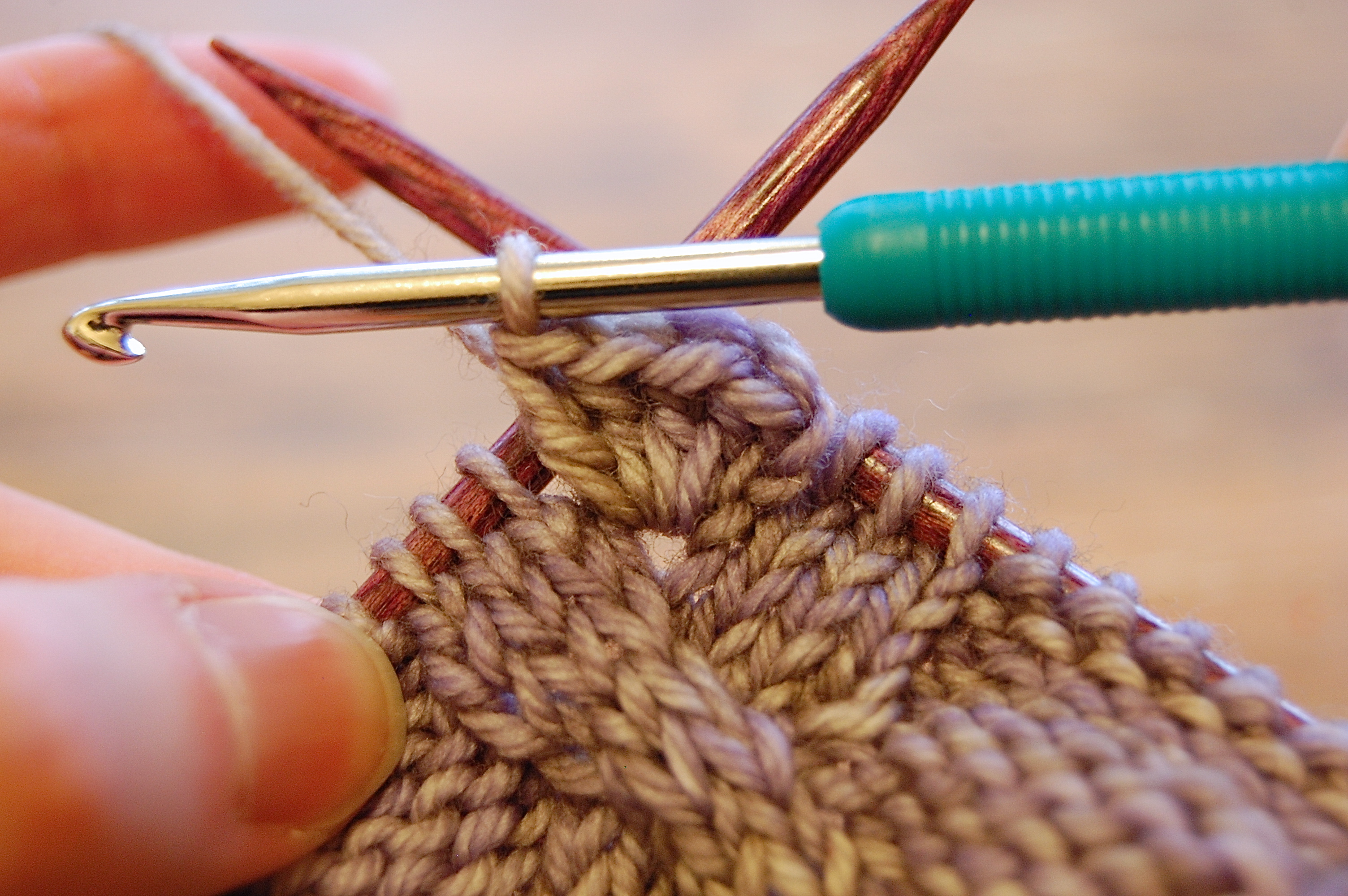 crocheting a bobble in a knitting project