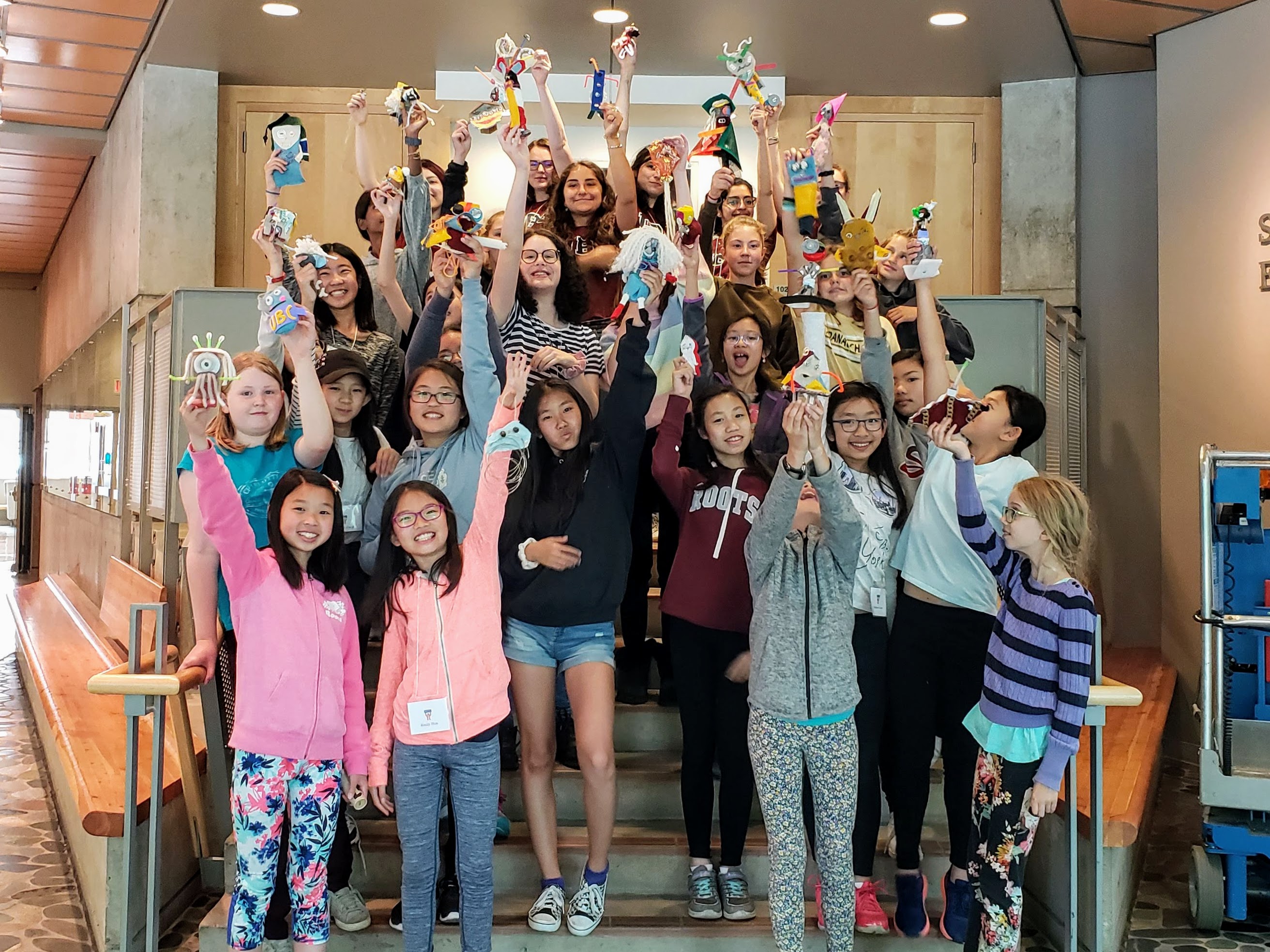 Group photo of girls-only maker campers with their Mighty Ugly creatures.