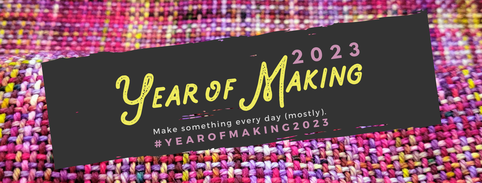 Against a woven fabric photo, a black swath on which is written "Year of Making 2023."
